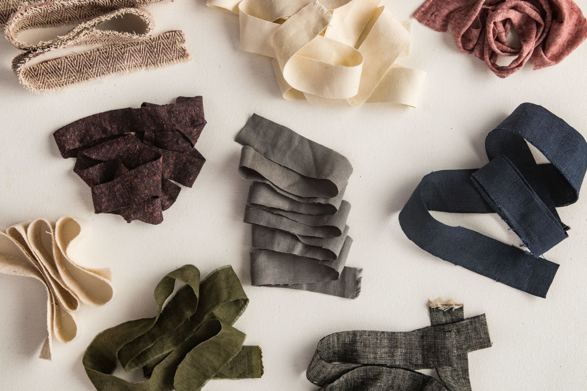 A collection of hemp fabric in a variety of colors and textures from Hemp Fabric Lab.