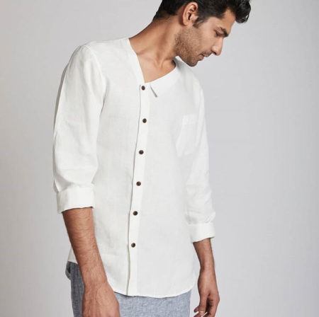 A male model poses in a long-sleeve white button down shirt made from hemp. White hemp shirt by India’s first hemp-based fashion brand, BLabel. Brands and designers of all sizes are exploring hemp fabric in India.