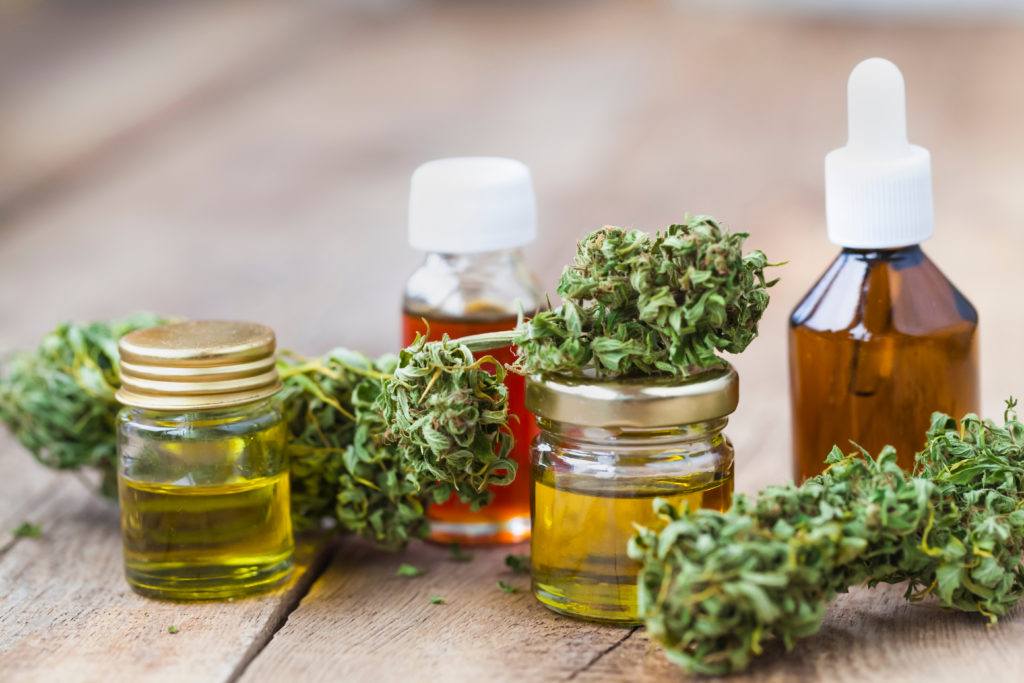 We took a closer look at CBD bioavailability for three popular ways to take this supplement. Photo: A collection of CBD oil bottles of different sizes & shapes, decorated with hemp flower buds.
