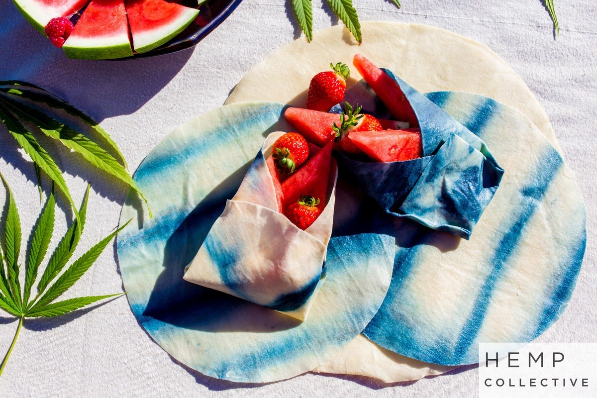 Photo: Hemp food wraps molded into a cone shape to hold fresh fruit on a table.