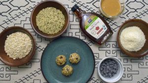 Photo: Ingredients for our easy hemp recipe, no bake hemp energy balls, include hemp hearts, maple syrup, peanut butter, and dark chocolate chips.