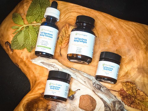 An array of Phytologica products available during the Black Friday sale, arranged with mint leaves on a wooden backdrop.