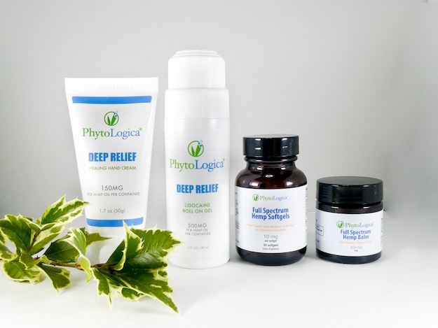 PhytoLogica Deep Relief bundle with three topical CBD products plus softgels, decorate with a sprig of ivy.