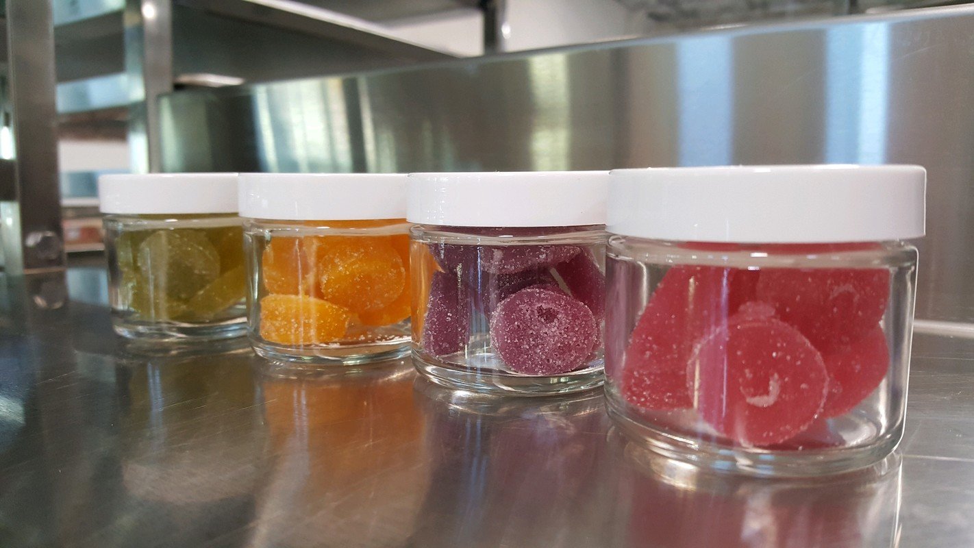 Photo: A row of gummies in jars ready for labeling and shipping to a CBD business.